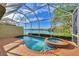 Enclosed pool and spa offer picturesque views of the lake and a private outdoor oasis at 4914 Lakescene Pl, Sarasota, FL 34243