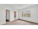 Bright bedroom with three windows, closet and adjacent bathroom at 7416 Riverview Dr, Bradenton, FL 34209