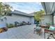 Cozy courtyard with comfortable seating, blue door, and fresh landscaping at 7416 Riverview Dr, Bradenton, FL 34209
