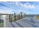 Private dock offers seating and a boat lift for easy water access and enjoyment at 7416 Riverview Dr, Bradenton, FL 34209