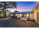 Charming front yard with walkway and accent lighting enhancing curb appeal at 7416 Riverview Dr, Bradenton, FL 34209