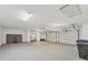 Spacious garage with storage racks and two bays at 7416 Riverview Dr, Bradenton, FL 34209