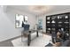 Stylish home office featuring a modern desk, comfortable chair, and built-in bookshelf at 7416 Riverview Dr, Bradenton, FL 34209