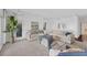 Bright and spacious living room with comfortable seating, natural light, and stylish decor at 7416 Riverview Dr, Bradenton, FL 34209