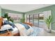 Bright main bedroom with a water view and a private pool at 7416 Riverview Dr, Bradenton, FL 34209