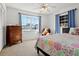 Cozy bedroom featuring a bright window, a colorful quilt, and an inviting teddy bear at 807 62Nd W St, Bradenton, FL 34209