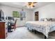This bedroom includes a ceiling fan, a large window, and space for both sleeping and a home office setup at 807 62Nd W St, Bradenton, FL 34209