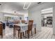 Dining area adjacent to the living room and kitchen, featuring a table set for four at 807 62Nd W St, Bradenton, FL 34209