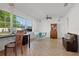 Large room with tile floors, large windows, ceiling fan and classic furniture at 807 62Nd W St, Bradenton, FL 34209