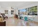 Bright room with large windows, tile floors, ceiling fan, seating and dining area at 807 62Nd W St, Bradenton, FL 34209