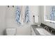 This bathroom features a modern sink, vanity, and a blue striped towel on the wall at 8818 29Th E St, Parrish, FL 34219