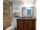 Bathroom features a shower, vanity, mirror, towels and beach themed decor at 1001 Benjamin Franklin Dr # 110, Sarasota, FL 34236
