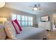 Neutral bedroom featuring plantation shutters and modern furniture at 1001 Benjamin Franklin Dr # 110, Sarasota, FL 34236