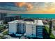 Stunning aerial view of the beachfront condo building with amazing views of the ocean at 1001 Benjamin Franklin Dr # 110, Sarasota, FL 34236