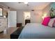 Inviting main bedroom featuring a ceiling fan, ensuite bathroom and a cozy place to relax after a day at the beach at 1001 Benjamin Franklin Dr # 110, Sarasota, FL 34236
