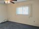 Empty bedroom with plush carpet and bright window at 3756 Lake Bayshore # 509, Bradenton, FL 34205