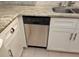 Stainless steel dishwasher seamlessly integrated into the kitchen cabinetry at 3756 Lake Bayshore # 509, Bradenton, FL 34205