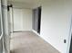 Enclosed lanai with white walls, tile floor and sliding doors at 3756 Lake Bayshore # 509, Bradenton, FL 34205