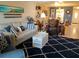 Cozy living room featuring stylish nautical decor, comfortable seating, and a bright atmosphere at 3756 Lake Bayshore # 509, Bradenton, FL 34205