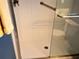 Shower with white tiled walls, glass door and grab bar at 3756 Lake Bayshore # 509, Bradenton, FL 34205