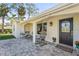 Cozy front porch featuring comfortable seating and decorative plants at 504 68Th Avenue W Dr, Bradenton, FL 34207