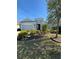 Charming single-story home with well-manicured landscaping and a two-car garage at 10923 Blue Magnolia Ln, Parrish, FL 34219