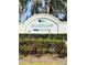 Silverleaf Neal Communities sign surrounded by green shrubs at 10923 Blue Magnolia Ln, Parrish, FL 34219
