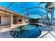 Inviting screened-in pool area with lush landscaping offering a private outdoor retreat at 1104 83Rd Nw St, Bradenton, FL 34209