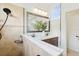 Bright bathroom featuring double sinks, a spacious shower, and contemporary finishes at 14614 Newtonmore Ln, Lakewood Ranch, FL 34202