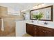 Bathroom features a double sink vanity and glass-enclosed shower at 14614 Newtonmore Ln, Lakewood Ranch, FL 34202