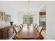 Formal dining room featuring a large window and wood furniture at 14614 Newtonmore Ln, Lakewood Ranch, FL 34202