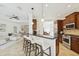 Kitchen featuring stainless steel appliances, a breakfast bar with seating, and modern pendant lighting at 14614 Newtonmore Ln, Lakewood Ranch, FL 34202