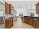 Spacious kitchen with modern appliances, dark countertops and beautiful wood cabinets at 14614 Newtonmore Ln, Lakewood Ranch, FL 34202