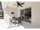 Covered outdoor patio with a ceiling fan, dining furniture, and view of pool at 14614 Newtonmore Ln, Lakewood Ranch, FL 34202