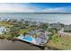 Aerial view of the community pool and clubhouse overlooking the bay at 25 Tidy Island Blvd, Bradenton, FL 34210