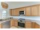 Bright kitchen with stainless steel appliances and granite countertops at 25 Tidy Island Blvd, Bradenton, FL 34210