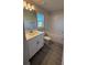 Bathroom featuring a vanity with a single sink and a tub with white tile surround at 2640 Averland Loop, North Port, FL 34287