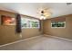 Bedroom with a fan, neutral walls, and natural lighting at 3395 Hardee Dr, Venice, FL 34292