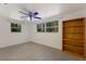 Bright bedroom with a fan, natural light, and a bookshelf at 3395 Hardee Dr, Venice, FL 34292