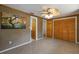 Spacious bedroom featuring built-in closet, a fan, and neutral walls at 3395 Hardee Dr, Venice, FL 34292