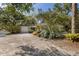 Street view of a single story home with mature landscaping at 3395 Hardee Dr, Venice, FL 34292