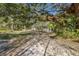 Quaint home nestled in a serene, lush landscape of mature trees and greenery at 3395 Hardee Dr, Venice, FL 34292