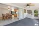 Open sunroom with views into the kitchen and outdoor scenery at 3395 Hardee Dr, Venice, FL 34292