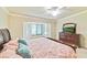 Comfortable bedroom with bay window and a dresser, providing ample space for relaxation and rest at 6705 Grand Estuary Trl # 201, Bradenton, FL 34212