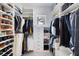 Custom walk-in closet with ample storage, shelving, and built in drawers at 6821 Longboat S Dr, Longboat Key, FL 34228
