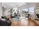 Open-concept living room featuring hardwood floors, a fireplace, and sliding glass doors to the exterior at 6821 Longboat S Dr, Longboat Key, FL 34228