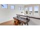 Landing area features a wood desk workspace and multiple bright windows with a peaceful water view at 6821 Longboat S Dr, Longboat Key, FL 34228