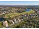 Beautiful aerial view of a home in a golf community with scenic lakes at 7902 Haven Harbour Way, Bradenton, FL 34212