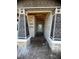 Covered entryway featuring a block construction and provides protection from the elements at 19591 Fort King Run, Brooksville, FL 34601