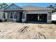 New home featuring garage and modern design; shows under construction and potential at 19591 Fort King Run, Brooksville, FL 34601